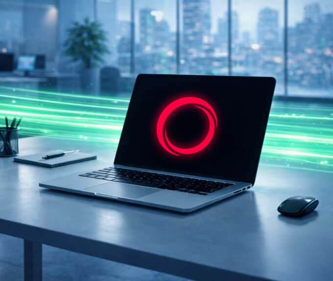 A laptop displaying a glowing red circular icon sits on a modern office desk with green data streams flowing behind it.